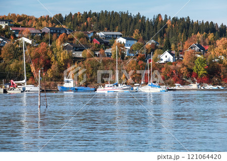 Motorboats and yachts moored in Norwegian marina Motorboats and yachts moored in Norwegian marina 121064420