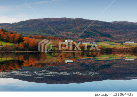 Norwegian landscape with hills and small coastal villages Norwegian landscape with hills and small coastal villages 121064438