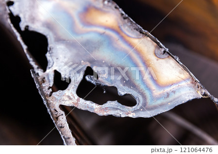 Abstract steel object with tempering colors pattern 121064476