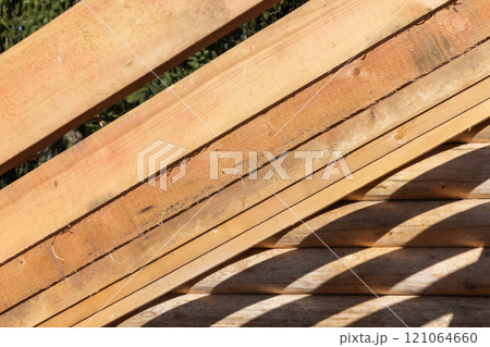 Wooden house roof is under construction. Rafters and beams Wooden house roof is under construction. Rafters and beams 121064660