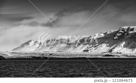 Icelandic landscape with snowy coastal mountains 121064673