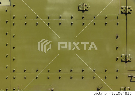Abstract industrial background texture with bolts of khaki steel wall Abstract industrial background texture with bolts of khaki steel wall 121064810