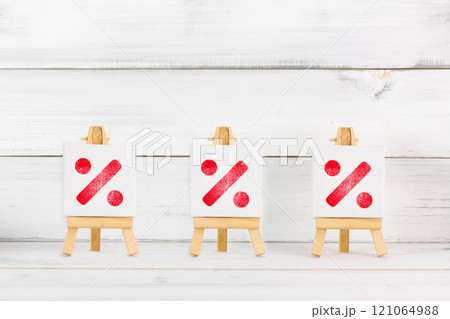 Red Percentage Symbols on Mini Canvases Representing Financial and Sales Concepts 121064988