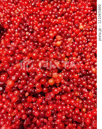 Table top view bunch of red currant in basket, Red currant berries with leaf on wooden table. 121065860