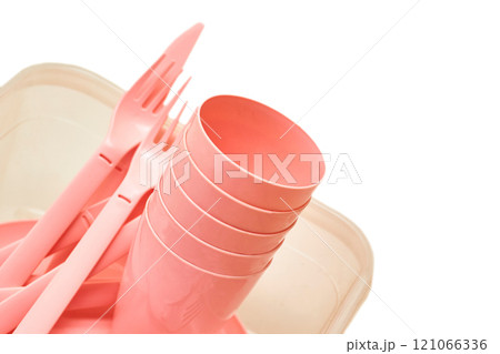 Plastic pink fork,cups,spoon,knife for camping, isolated on white Plastic pink fork,cups,spoon,knife for camping, isolated on white 121066336