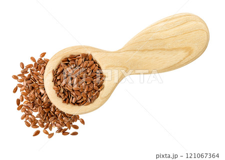flaxseed in wooden spoon isolated on white background. Top view. Flat lay flaxseed in wooden spoon isolated on white background. Top view. Flat lay 121067364