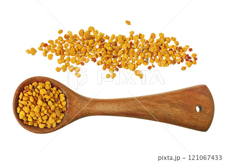 Bee pollen grains in wooden spoon isolated on white background. Top view. Flat lay 121067433