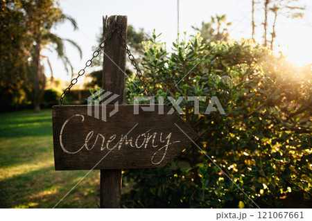 A rustic wooden sign displaying the word ceremony is seen here A rustic wooden sign displaying the word ceremony is seen here 121067661