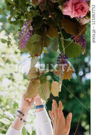 A woman is holding a beautiful bouquet of colorful flowers 121067752