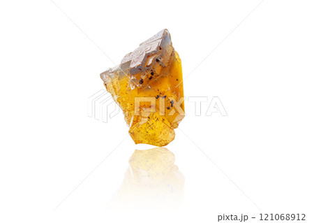 Macro mineral stone Fluorite yellow and blue color on a white background 121068912