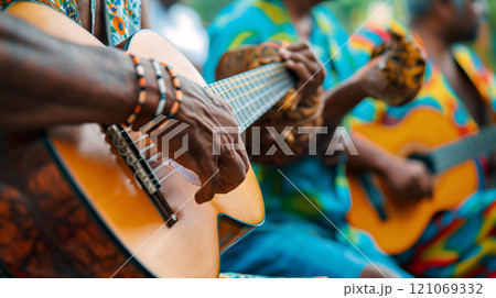 Musicians performing on traditional instruments at a lively outdoor gathering in a vibrant cultural celebration 121069332