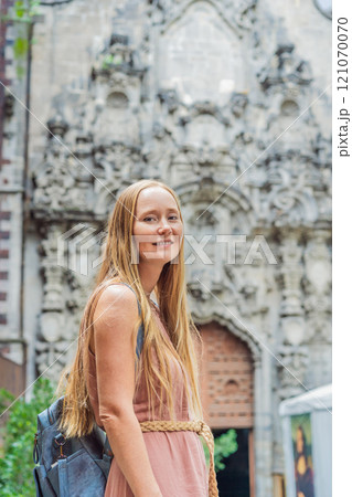 Female tourist in the central square of Mexico City, Zocalo. Cultural exploration, travel, and historic architecture concept 121070070