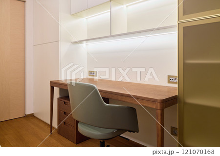 A Modern Workspace Featuring a Minimalistic Design That Emphasizes Natural Light and Comfort A Modern Workspace Featuring a Minimalistic Design That Emphasizes Natural Light and Comfort 121070168