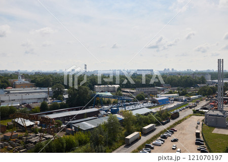An Urban Industrial Landscape featuring lush Greenery contrasted by a stunning City Skyline An Urban Industrial Landscape featuring lush Greenery contrasted by a stunning City Skyline 121070197