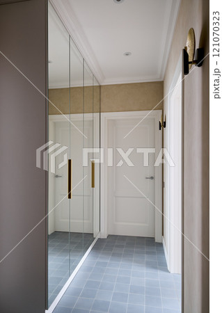 An Elegant and Modern Hallway Featuring Reflective Surfaces and Chic Stylish Details An Elegant and Modern Hallway Featuring Reflective Surfaces and Chic Stylish Details 121070323