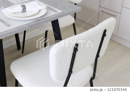 This modern dining chair design features a stylish texture that enhances any rooms aesthetic 121070348
