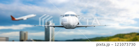 Commercial airplane flying in the sky above the city skyline with a cloudscape background Commercial airplane flying in the sky above the city skyline with a cloudscape background 121073730