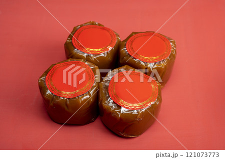 Chinese New Year rice cake or Nian Gao on the table. Also popular as Kue Keranjang or Dodol China Chinese New Year rice cake or Nian Gao on the table. Also popular as Kue Keranjang or Dodol China 121073773
