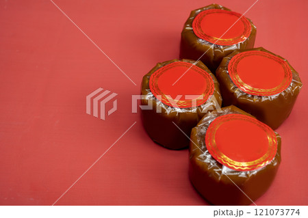 Chinese New Year rice cake or Nian Gao on the table. Also popular as Kue Keranjang or Dodol China Chinese New Year rice cake or Nian Gao on the table. Also popular as Kue Keranjang or Dodol China 121073774