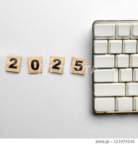 Wooden cubes with the number 2025 on a white background Wooden cubes with the number 2025 on a white background 121074138