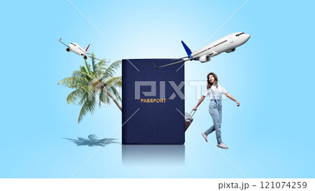 Portrait of a woman in hat carrying a suitcase with a passport and flying a commercial airplane on a blue color background Portrait of a woman in hat carrying a suitcase with a passport and flying a commercial airplane on a blue color background 121074259