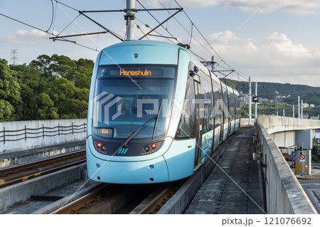 A train traveling on the Danhai Light Rail transit (LRT) in New Taipei City, Taiwan. 121076692