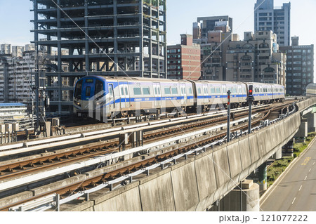 View of a Taoyuan International Airport line train running on the elevated track of the Taoyuan Mass Rapid Transit System. 121077222