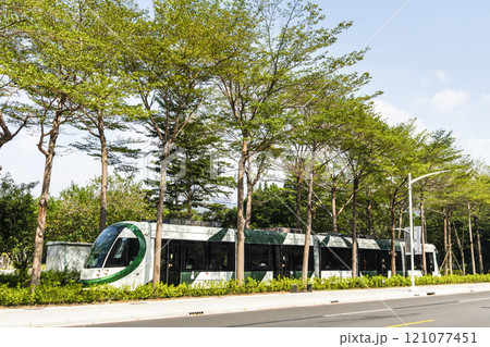 The circular light rail train drives past the Kaohsiung Museum of Fine Arts station in Taiwan. 121077451