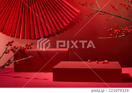 Chinese New Year idea, with a close-up angle of red rectangular podiums that are empty for placed products, decorated by red berry fruits, winterberry branches, and a red fan in a crimson background. Chinese New Year idea, with a close-up angle of red rectangular podiums that are empty for placed products, decorated by red berry fruits, winterberry branches, and a red fan in a crimson background. 121078329