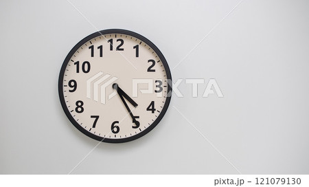 Classic Black-Edged Clock on White Background at 16.25/04.25 - Perfect for Time Management and Text Space Classic Black-Edged Clock on White Background at 16.25/04.25 - Perfect for Time Management and Text Space 121079130