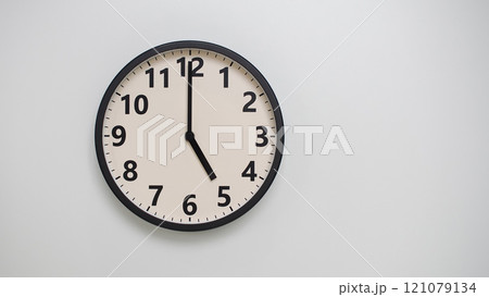 Classic Black-Edged Clock on White Background at 17.00/05.00 - Perfect for Time Management and Text Space 121079134