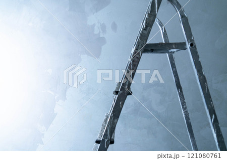 Using microcement adhesive for fixing surfaces while on a ladder in a work area. Using microcement adhesive for fixing surfaces while on a ladder in a work area. 121080761