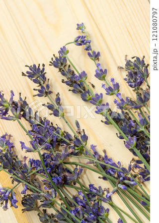 Bouquet of natural lavender on a light wooden background, vertical shot 121080797