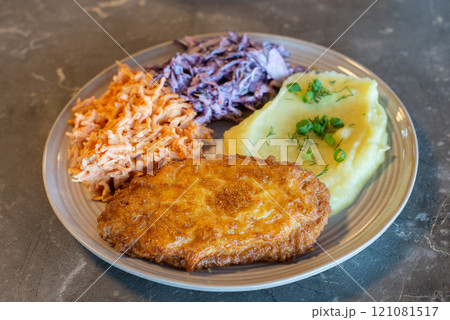 Meat dish on table homemade with salads Meat dish on table homemade with salads 121081517
