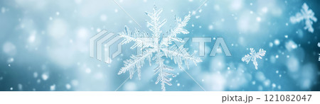 Delicate snowflakes falling gently in winter wonderland scene 121082047