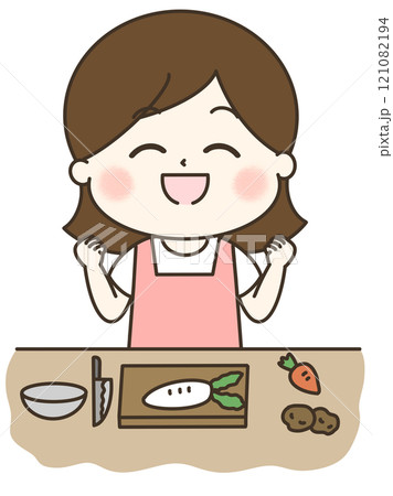 頑張るぞと気合を入れて料理をするエプロンの女性 121082194