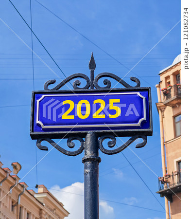Business concept of 2025 new year symbol. Beautiful blue old retro road sign with number 2025. Beautiful blue sky and city building background, copy space. Business 2025 happy new year concept. Business concept of 2025 new year symbol. Beautiful blue old retro road sign with number 2025. Beautiful blue sky and city building background, copy space. Business 2025 happy new year concept. 121082734