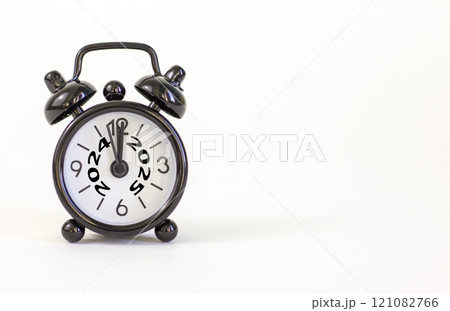Business concept of 2025 new year symbol. Beautiful orange paper with number 2024 and 2025. Beautiful orange background, copy space. Black alarm clock. Business 2025 happy new year concept. 121082766