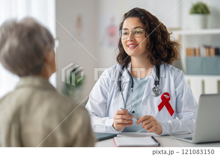 patient and a doctor in medical office 121083150