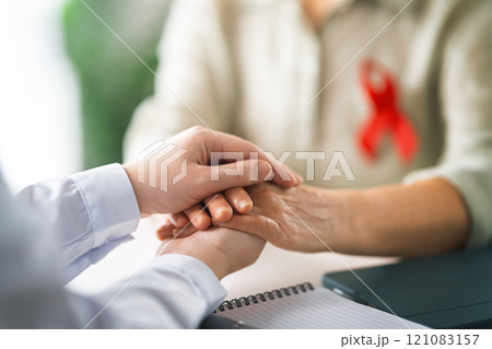 patient and a doctor in medical office 121083157