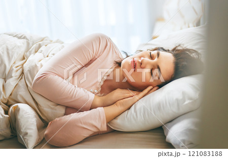 woman is sleeping in the bedroom woman is sleeping in the bedroom 121083188