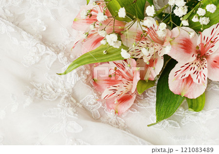 Pink flowers on white lace Pink flowers on white lace 121083489