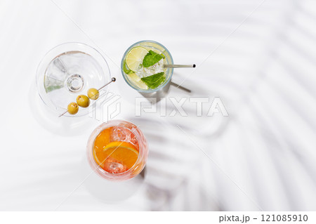A vibrant display of cocktails, including Aperol Spritz, Mojito, and Martini 121085910