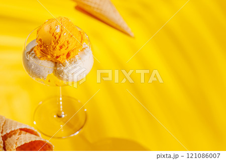 A refreshing ice cream set against a vibrant yellow background 121086007