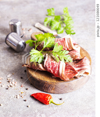 Raw beef fillet on on wooden board 121086649