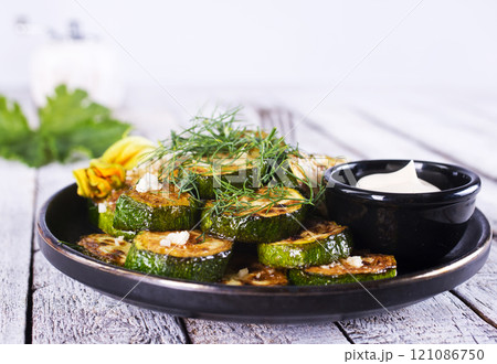 Homemade Oven Roasted Zucchini Slices with Garlic and Pepper 121086750