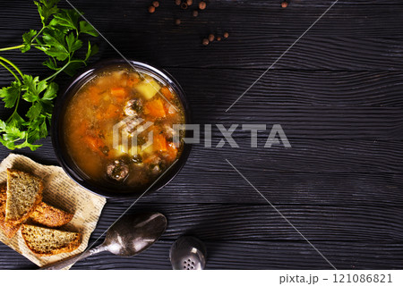 Homemade vegetable dietitioan meatball soup in pot. 121086821