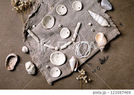handcrafted beads from raw porcelain 121087469