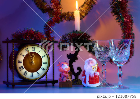Santa Claus, vintage clock, wine glasses, burning candle.New Year,Christmas 121087759