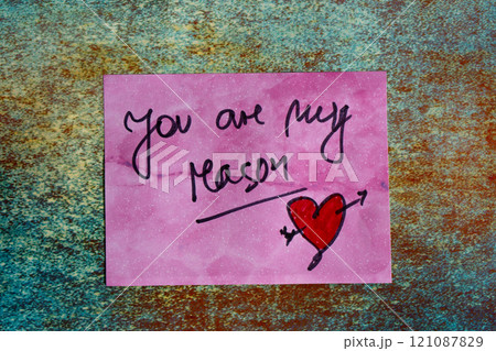 Love note on a post-it or self-adhesive paper. 121087829